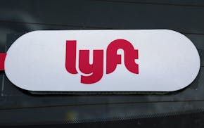 FILE - This Jan. 31, 2018 file photo shows a Lyft logo on a Lyft driver's car in Pittsburgh. Lyft officially kicked off the road show for its initial