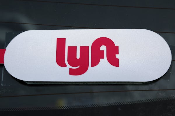 FILE - This Jan. 31, 2018 file photo shows a Lyft logo on a Lyft driver's car in Pittsburgh. Lyft officially kicked off the road show for its initial 