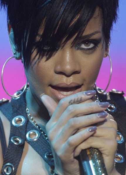 International pop singer Rihanna sings during a concert with Chris Brown in suburban Taguig, south of Manila, Philippines on Sunday Nov. 16, 2008.