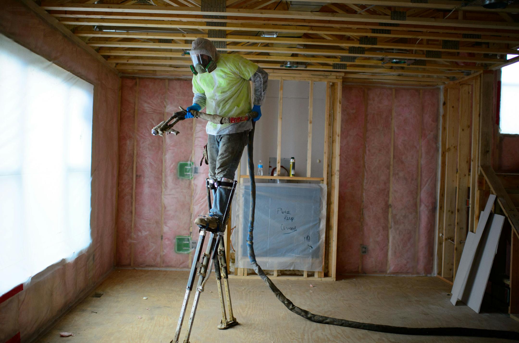 Tony Kubat of Metro Home Insulation uses a new product, GracoInsite to track the quality and time required to apply insulation. The automated monitoring system can detect if the chemical reaction is working properly and if the home is getting insulated properly. Wednesday, November 20, 2013. ] GLEN STUBBE * gstubbe@startribune.com