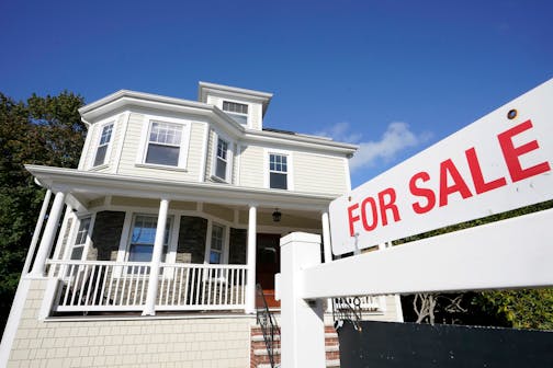 FILE - A for sale sign stands in front of a house, on Oct. 6, 2020, in Westwood, Mass. Average long-term U.S. mortgage rates jumped back up ahead of next week's Federal Reserve meeting where it's expected to announce another increase to its main borrowing rate. Mortgage buyer Freddie Mac reported Thursday, June 9, 2022, that the 30-year rate jumped to 5.23% this week from 5.09% last week. (AP Photo/Steven Senne, File)