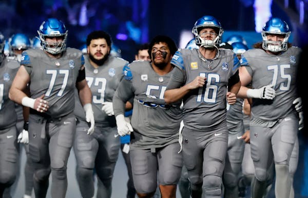 Lions quarterback Jared Goff (16) plays behind the best offensive line in the playoffs, including center Frank Ragnow (77), guard Jonah Jackson (73) a