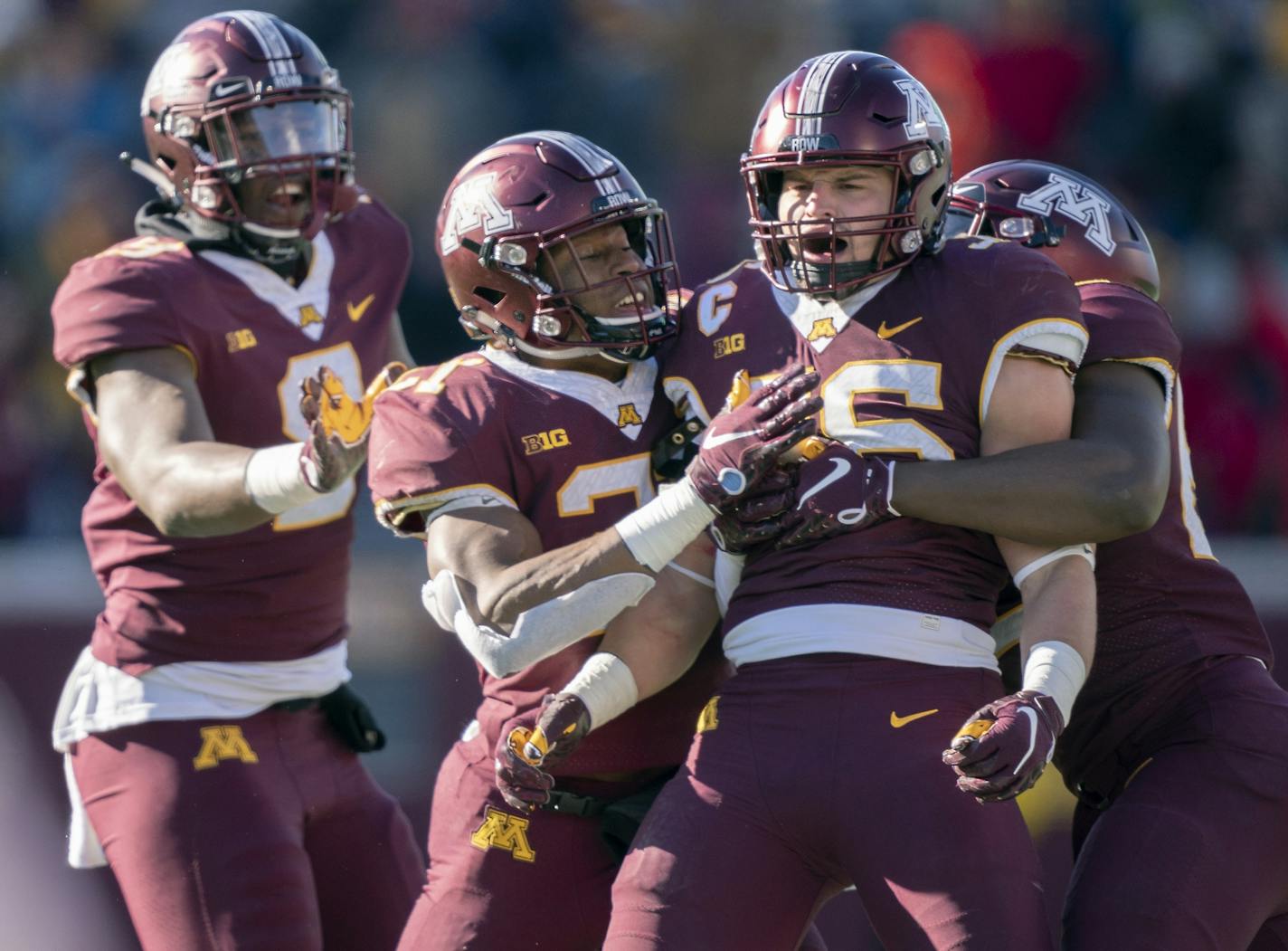 Blake Cashman celebrated after he sacked Northwestern quarterback Clayton Thorson