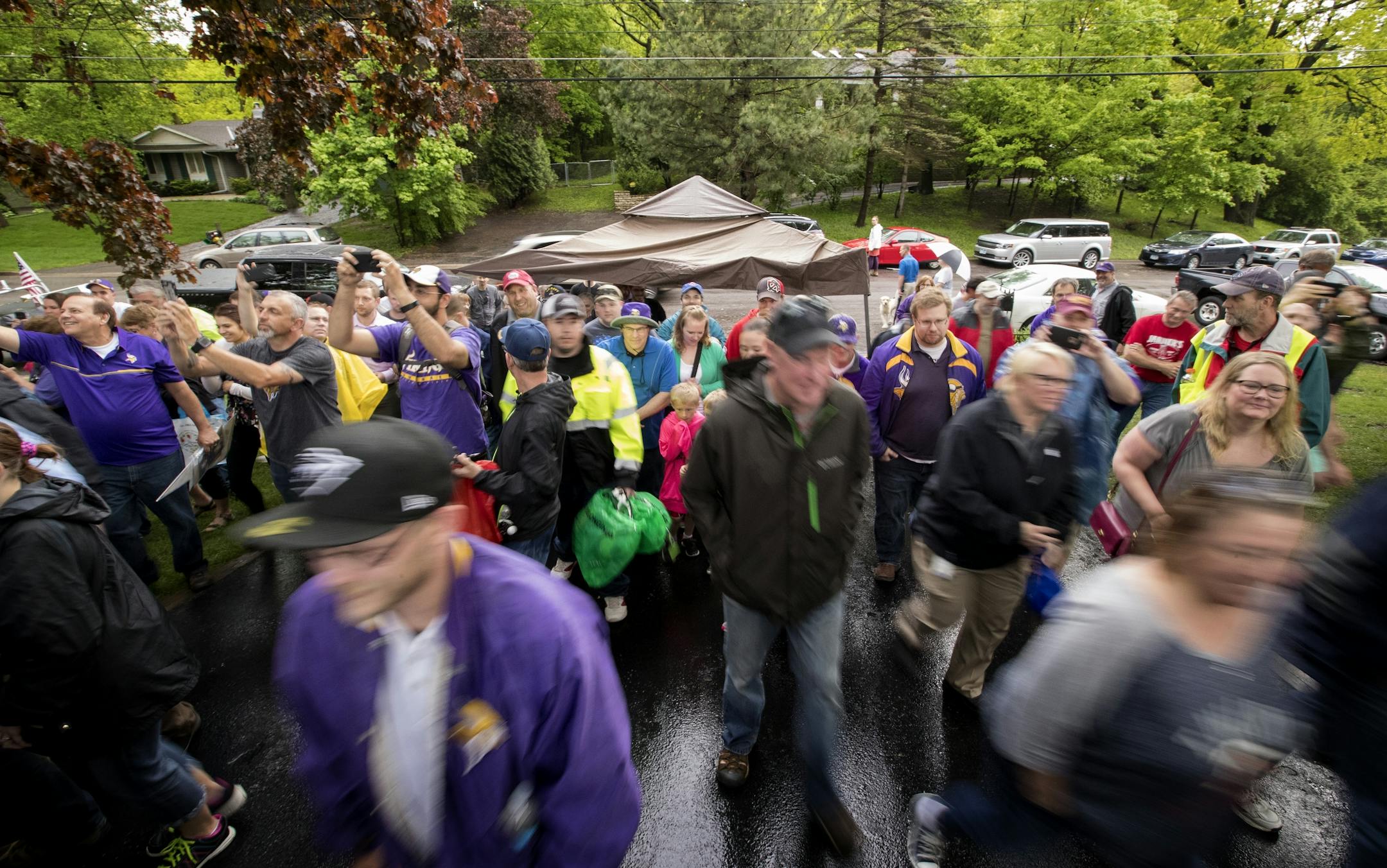 Shoppers made their way up the driveway after a whistle by Bud Grant signaling the beginning of his garage sale.