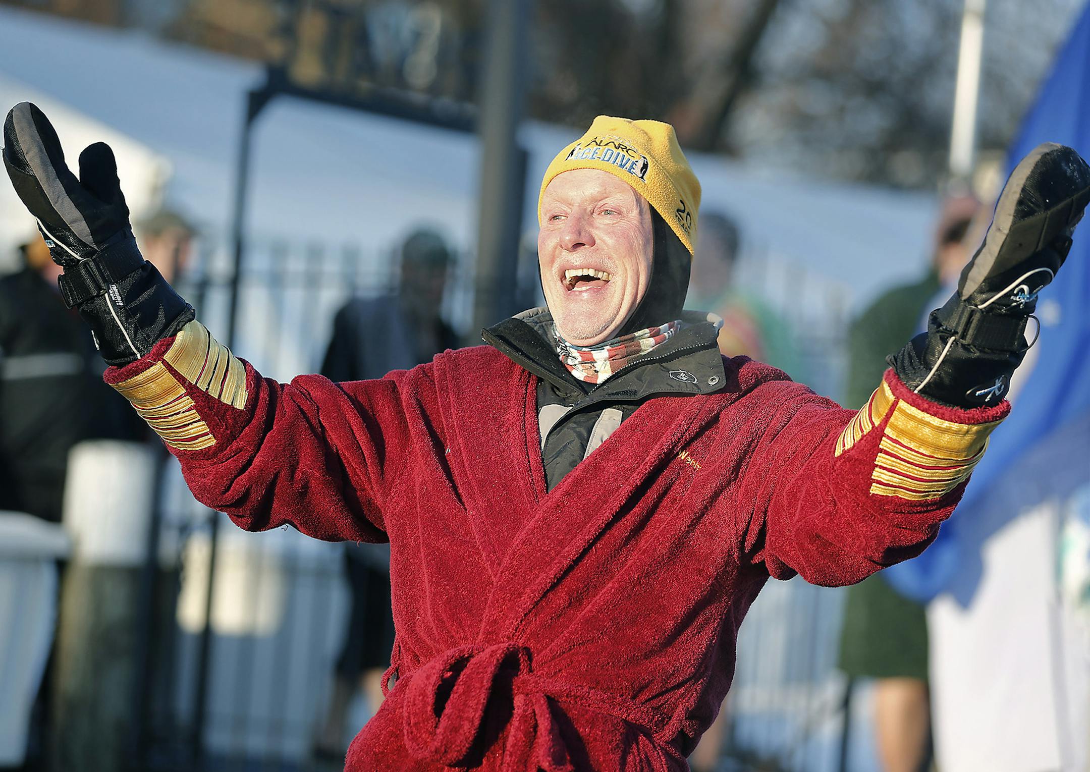Co-founder Bill Wenmark, an avid marathoner, cheered on as jumpers plunged into the 32 degree Lake Minnetonka for the 27th Annual ALARC Ice Dive, Sunday, January 1, 2017 in Excelsior, MN. About 800 braved the icy waters to ring in the new year and to contribute to the Wounded Warrior Project. ] (ELIZABETH FLORES/STAR TRIBUNE) ELIZABETH FLORES • eflores@startribune.com