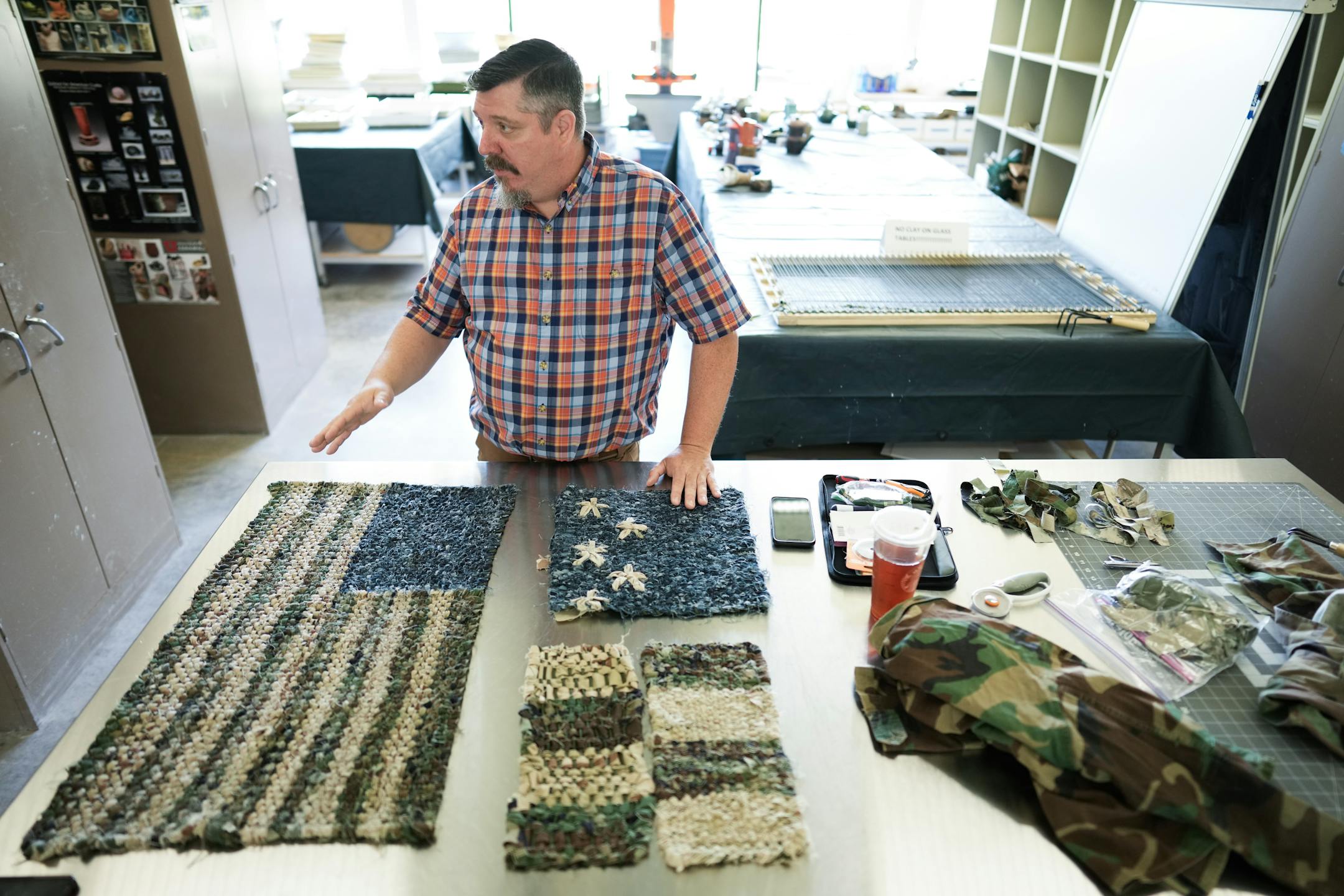 Army veteran and artist Jeffrey Stenbom demonstrated how he weaves American flags using old service member uniforms.