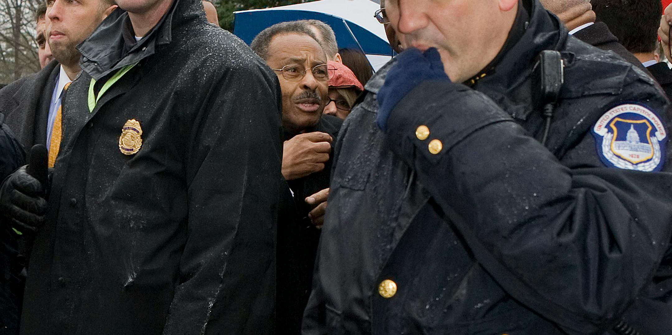 Roland Burris, center, leaves the U.S. Capitol after being denied a seat in the U.S. Senate, Tuesday, Jan. 6, 2009 in Washington. Burris announced Tuesday he was rejected for Barack Obama's Senate seat, in a bizarre rainy-day scene on the Capitol grounds as lawmakers awaited the gaveling of the 111th Congress into session.