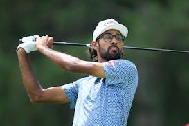 Akshay Bhatia hits off the fourth tee during the first round of the Rocket Mortgage Classic in Detroit.