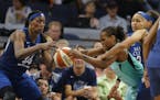 Sylvia Fowles (34) and Kia Nurse(5) fight for the ball during a game between the Lynx and New York earlier this season. .