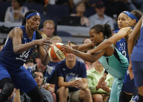 Sylvia Fowles (34) and Kia Nurse(5) fight for the ball during a game between the Lynx and New York earlier this season. .