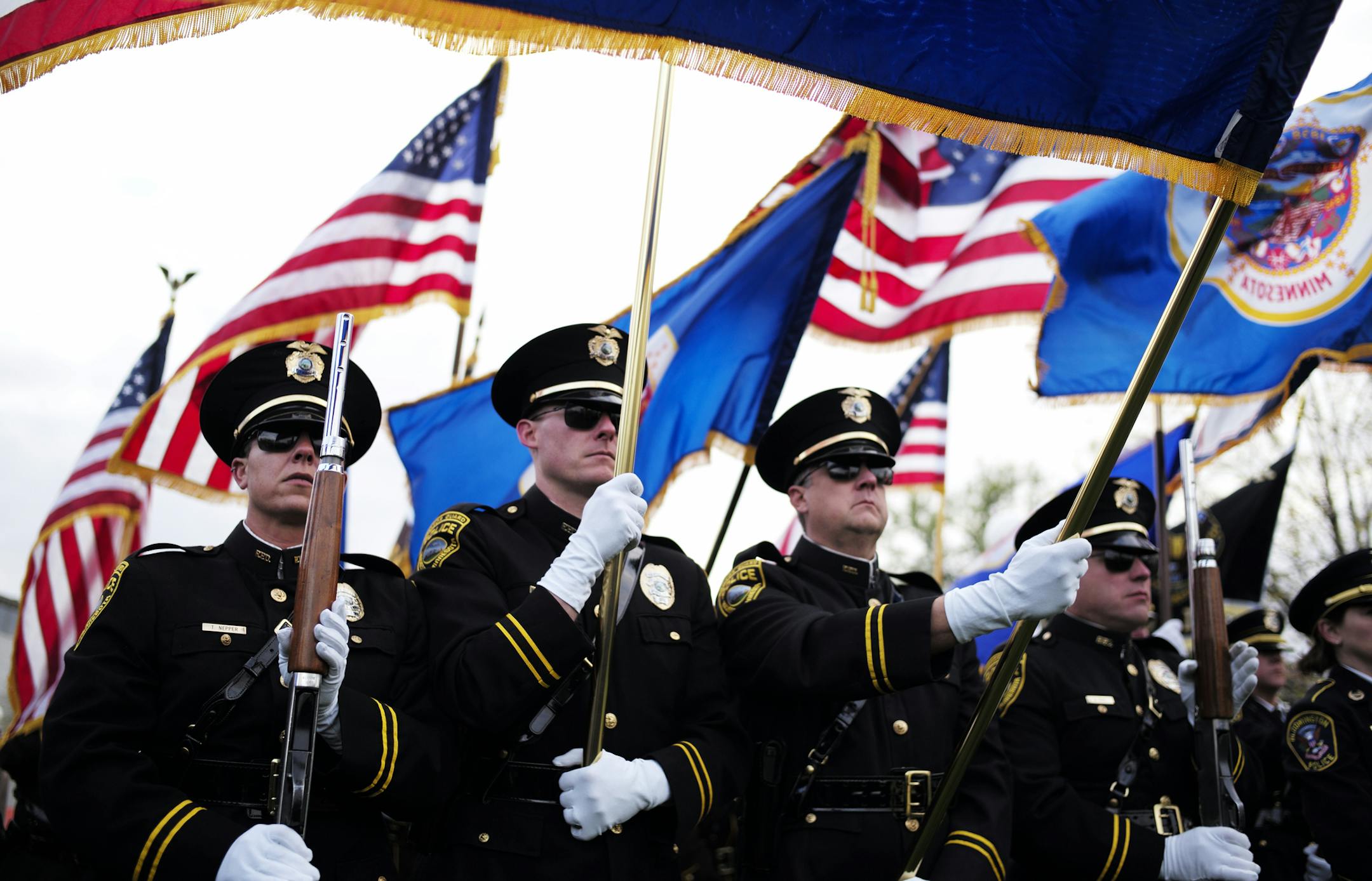 On May 15, 2014,at the Peace Officers Memorial on the State Capitol Grounds, police officers from around the state and family members paid tribute to fallen Minnesota peace officers. Rochester police honor guard members (from left to right)) Tracy Nepper, Sgt. R.T. Manguson, T.S. Whalen, and Bert Otto paid their respects.] richard.tsong-taatarii/rtsong-taatarii@startribune.com