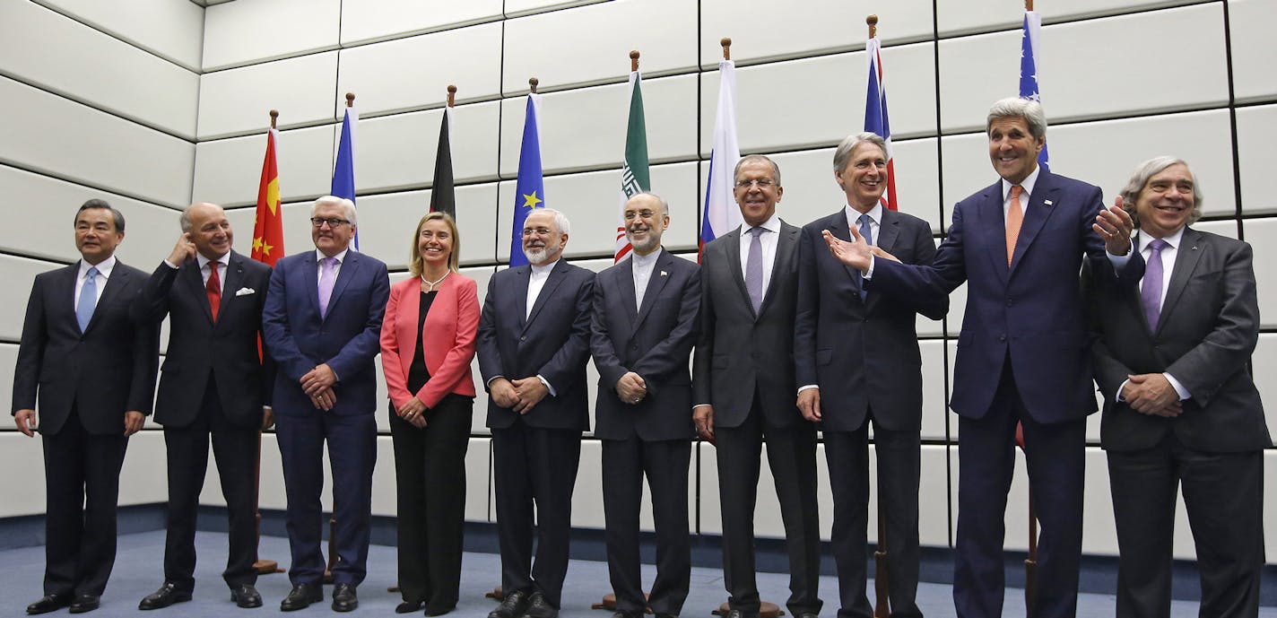 From left to right, Chinese Foreign Minister Wang Yi, French Foreign Minister Laurent Fabius, German Foreign Minister Frank Walter Steinmeier, European Union High Representative for Foreign Affairs and Security Policy Federica Mogherini, Iranian Foreign Minister Mohammad Javad Zarif, Head of the Iranian Atomic Energy Organization Ali Akbar Salehi, Russian Foreign Minister Sergey Lavrov, British Foreign Secretary Philip Hammon, U.S. Secretary of State John Kerry and U.S. Secretary of Energy Ernes