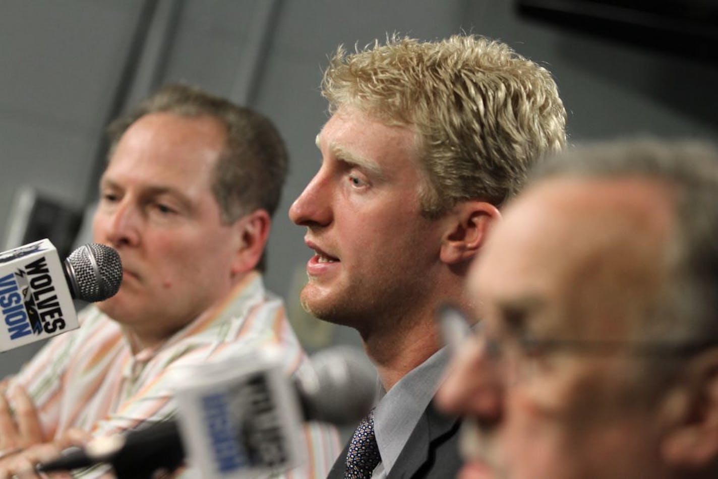 Chase Budinger answered media questions as he was introduced during a press conference at Target Center. He was flanked by (left) President of Basketball Operations David Kahn and (right) Head Coach Rick Adelman.