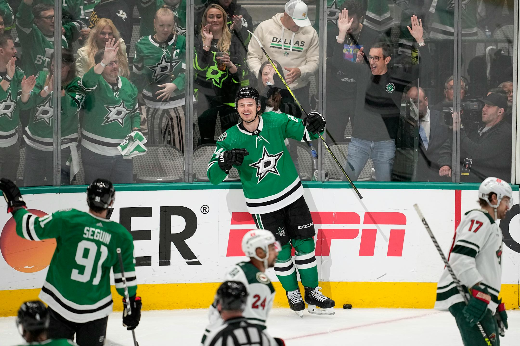 Dallas Stars' Roope Hintz, center, celebrates with Tyler Seguin after scoring his third goal of the game in the third period of Game 2.
