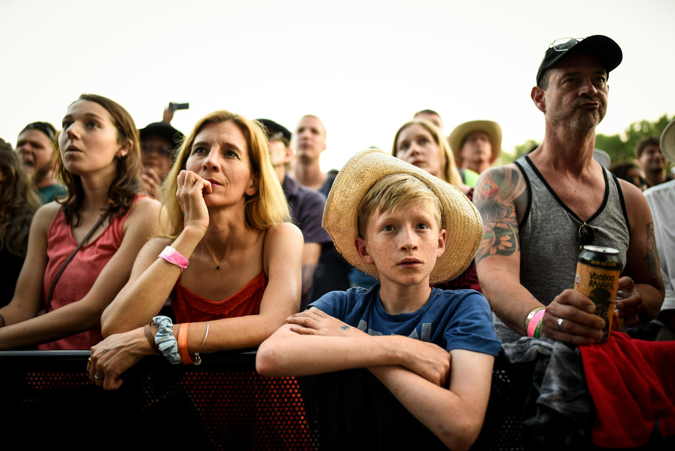 Lysander Duffield, 11, and his mother, Cher, of Brookline, Mass., were transfixed on political messaging broadcast at the start of Pussy Riot's set Saturday on the Lake Eaux Lune stage. ] AARON LAVINSKY ï aaron.lavinsky@startribune.com Day two of the Eaux Claires Music & Art Festival was held Saturday, July 7, 2018 at Foster Farms in Eau Claire, Wisc.