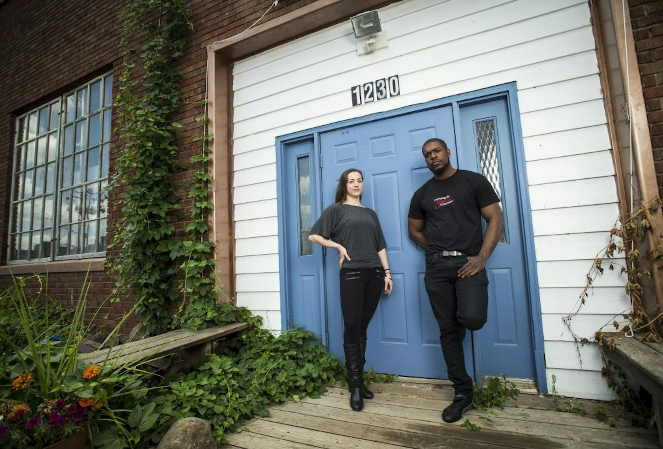 Byron Johnson, owner of Duende Studio, and Leah Lapic, a dance instructor, stand in front of the building they hope to turn into a dance studio on NE. Quincy Street on Wednesday.