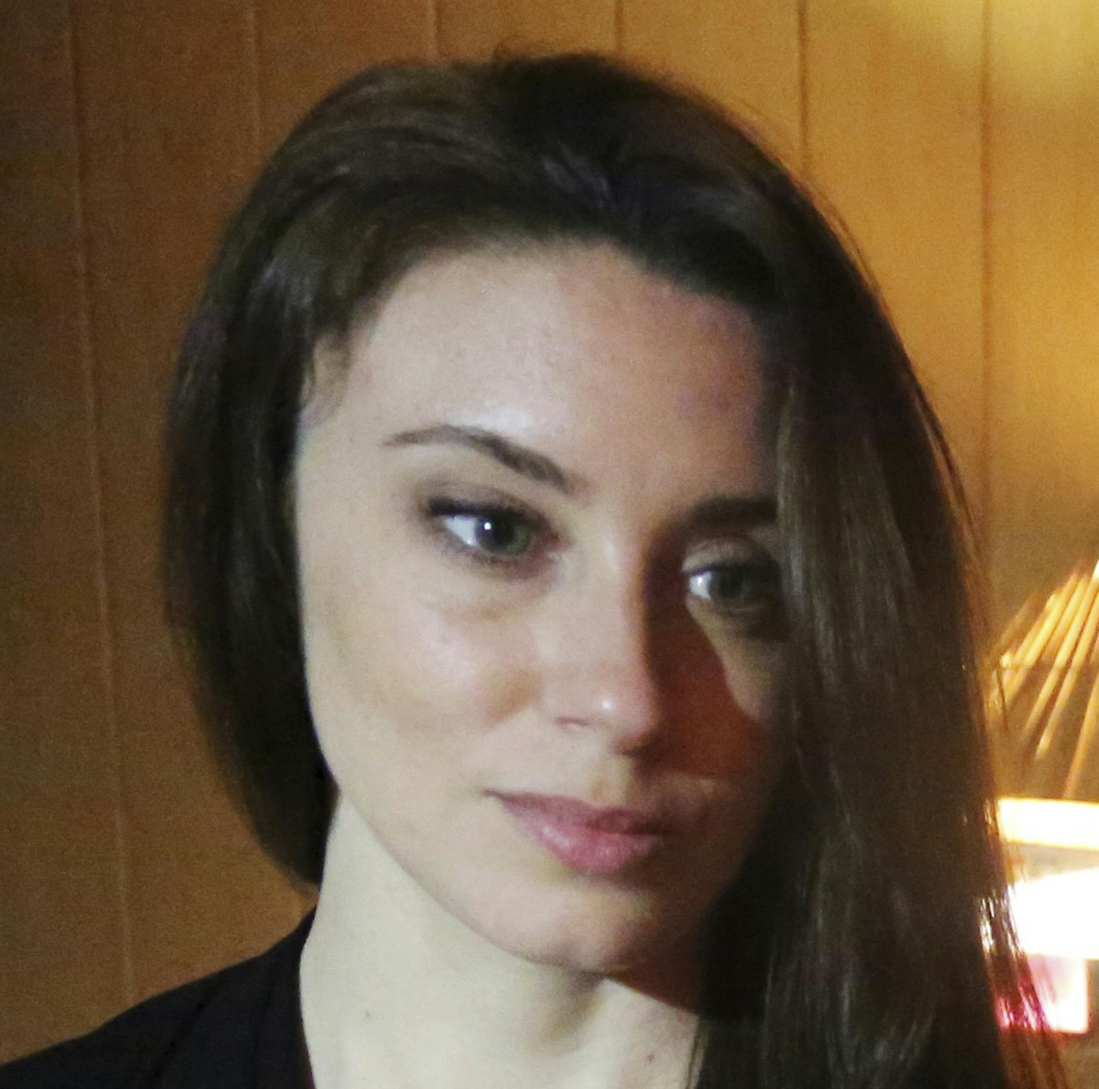 In this Feb. 13, 2017 photo, Casey Anthony poses for a portrait next to a photo of her daughter, Caylee, in her West Palm Beach, Fla., bedroom. In an exclusive interview with The Associated Press, Anthony claims the last time she saw Caylee she ìbelieved that she was alive and that she was going to be OK.î (AP Photo/Joshua Replogle)