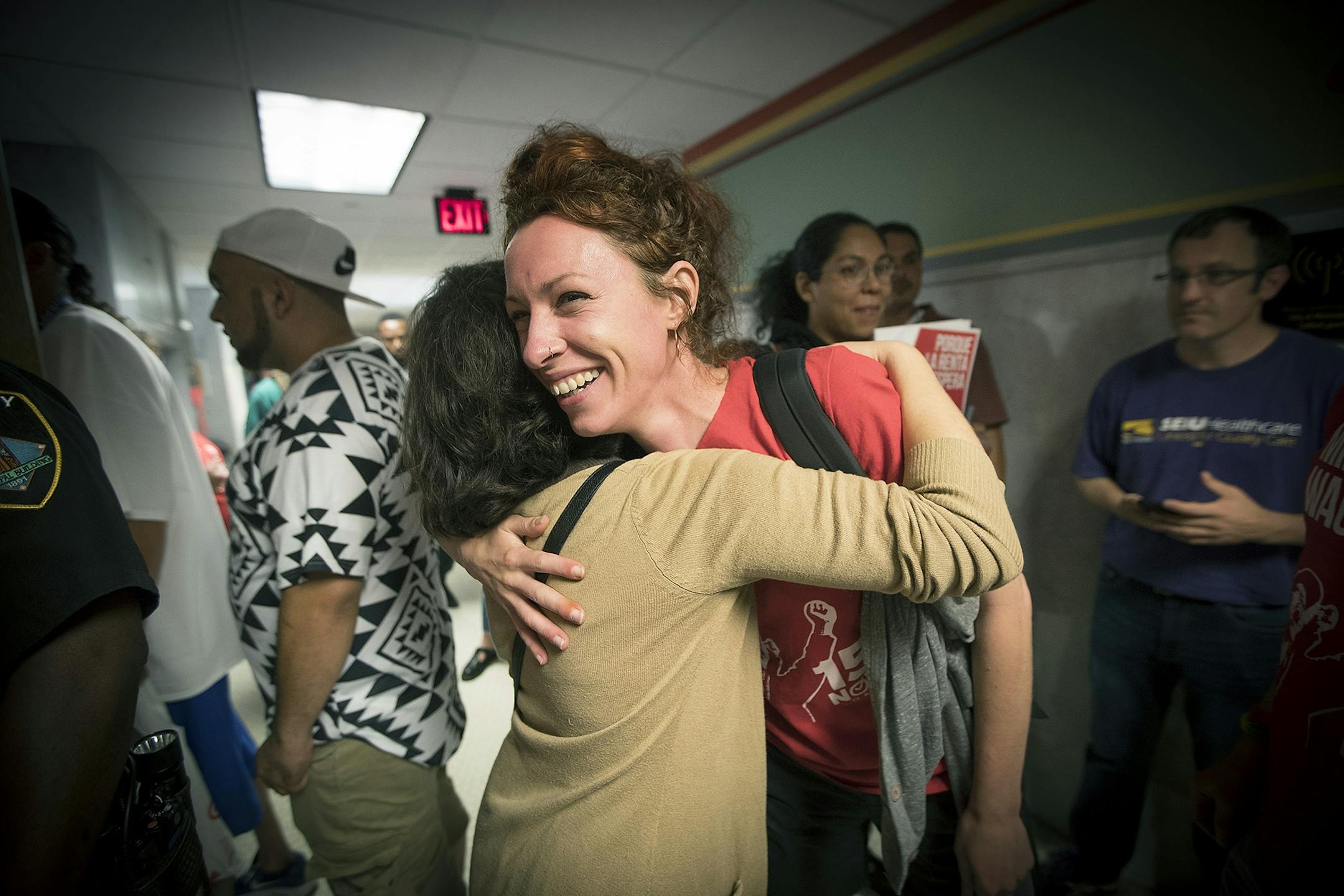 Minneapolis city council candidate Ginger Jentzen celebrated with other supporters of the $15 minimum wage increase after it was passed by City Council at City Hall, Friday, June 30, 2017 in Minneapolis, MN.
