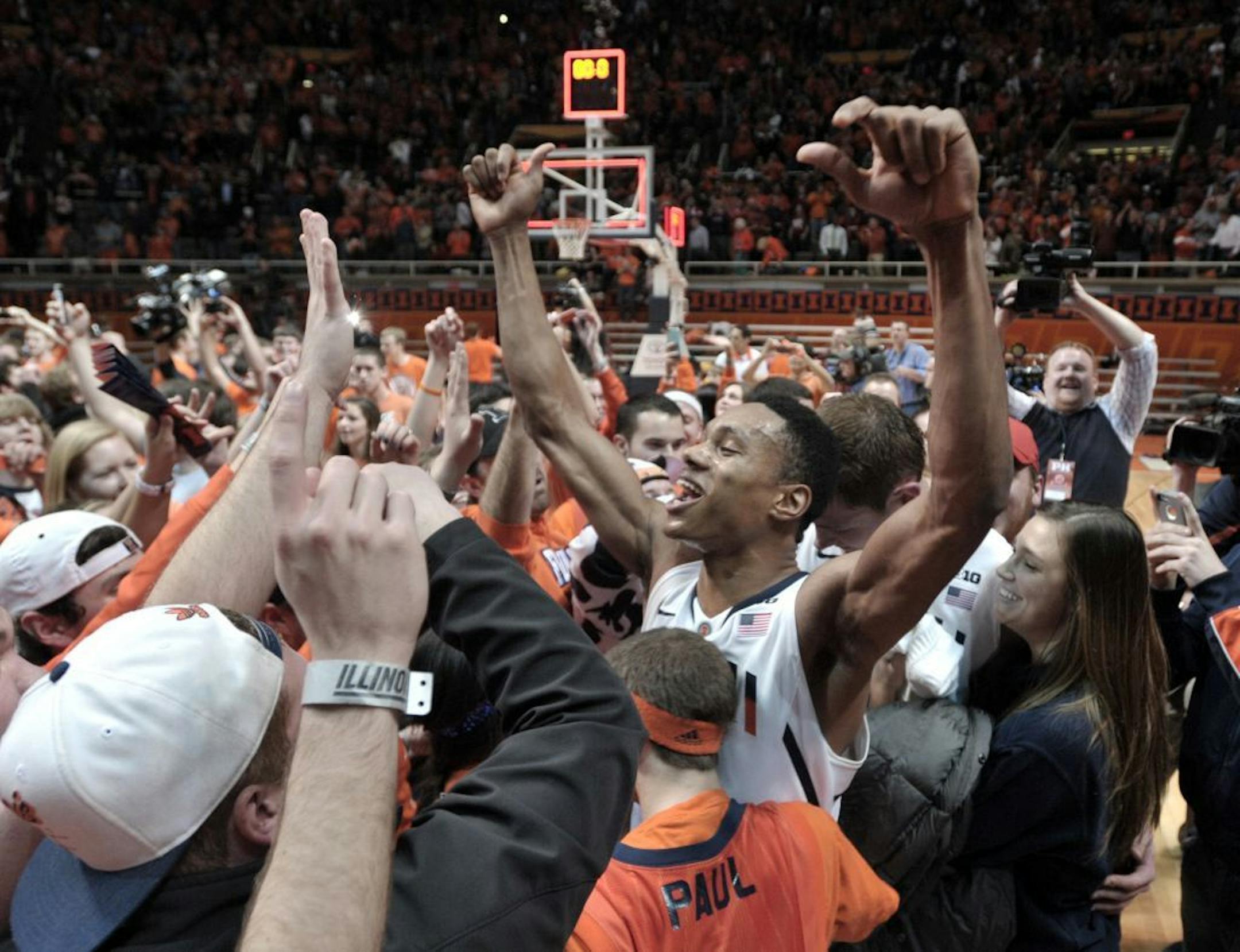 Illinois' Joseph Bertrand celebrates after Illinois defeated No. 1-ranked Indiana in an NCAA college basketball game at Assembly Hall in Champaign, Ill., on Thursday, Feb. 7, 2013. Illinois won 74-72.