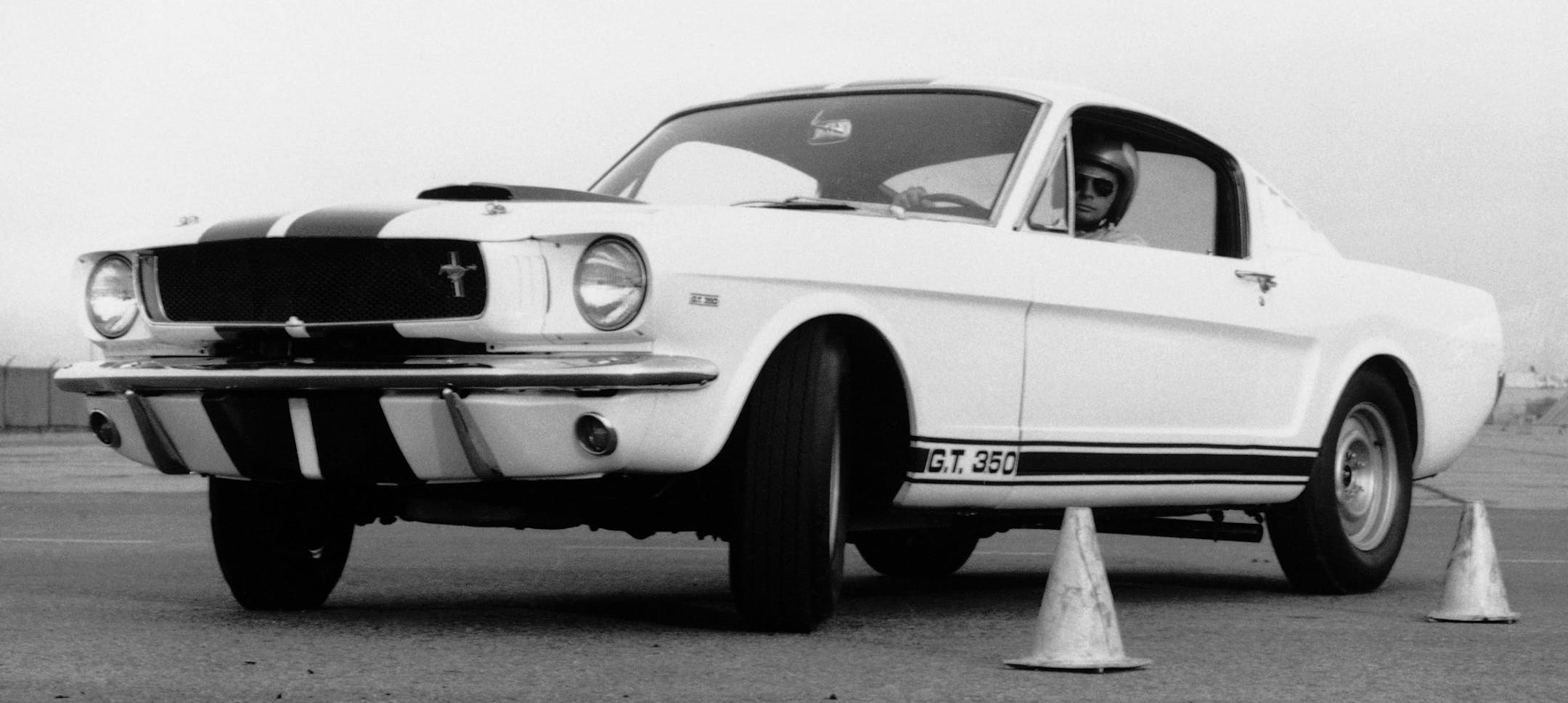 FILE - The Mustang GT 350, is shown in this March 1965 file photo as the car to beat in sports car club of American Class B production racing. The sleek fastback built by Carroll Shelby attracts high interest among sports car enthusiasts. Shelby, the legendary race driver and Shelby Cobra sports car designer, has died at age 89. Shelby's company Carroll Shelby International says Shelby died Thursday, May 10, 2012, at a Dallas hospital. He had received a heart transplant in 1990 and a kidney tran