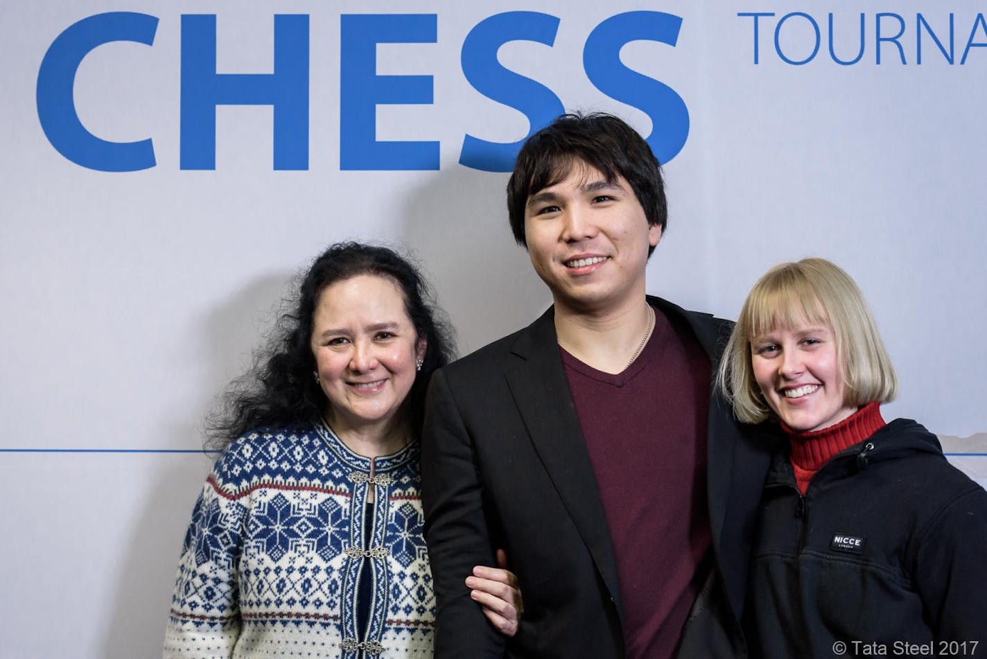 Minnetonka chess Grandmaster Wesley So, 23, is shown with his adoptive family, Lotis Key, left, and Abbey Key, after winning the Tata Steel Chess tournament in the Netherlands.