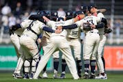 The Minnesota Twins celebrate after defeating the Los Angeles Dodgers 3-2 at Target Field in Minneapolis, Minn., on Wednesday, April 10, 2024.     ]

