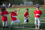 Zytavius, left of center, and Ja'Kiya, showed off their dance moves as Malachi, far left and Breeze looked on during a coach pitch Monarchs practice a
