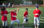 Zytavius, left of center, and Ja'Kiya, showed off their dance moves as Malachi, far left and Breeze looked on during a coach pitch Monarchs practice a