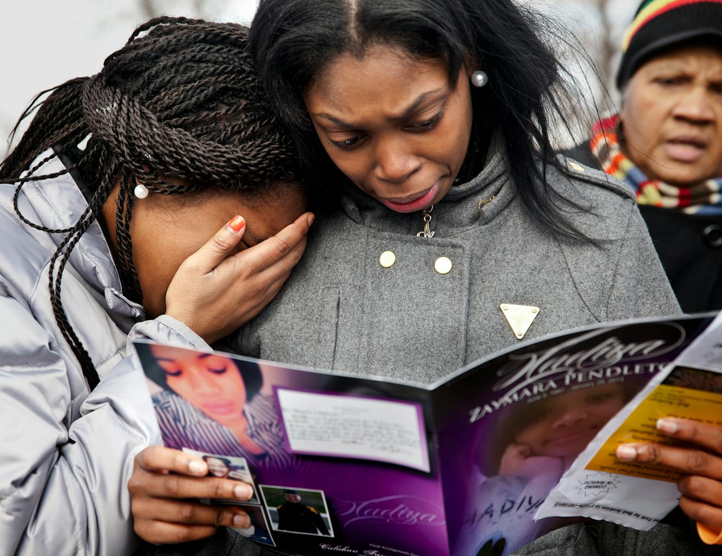 Danyia Bell, left, and Artureana Terrell, 16, who went to school with Hadiya Pendleton, gather with mourners outside the Greater Harvest Baptist during Pendleton's funeral in Chicago, Feb. 9, 2013.