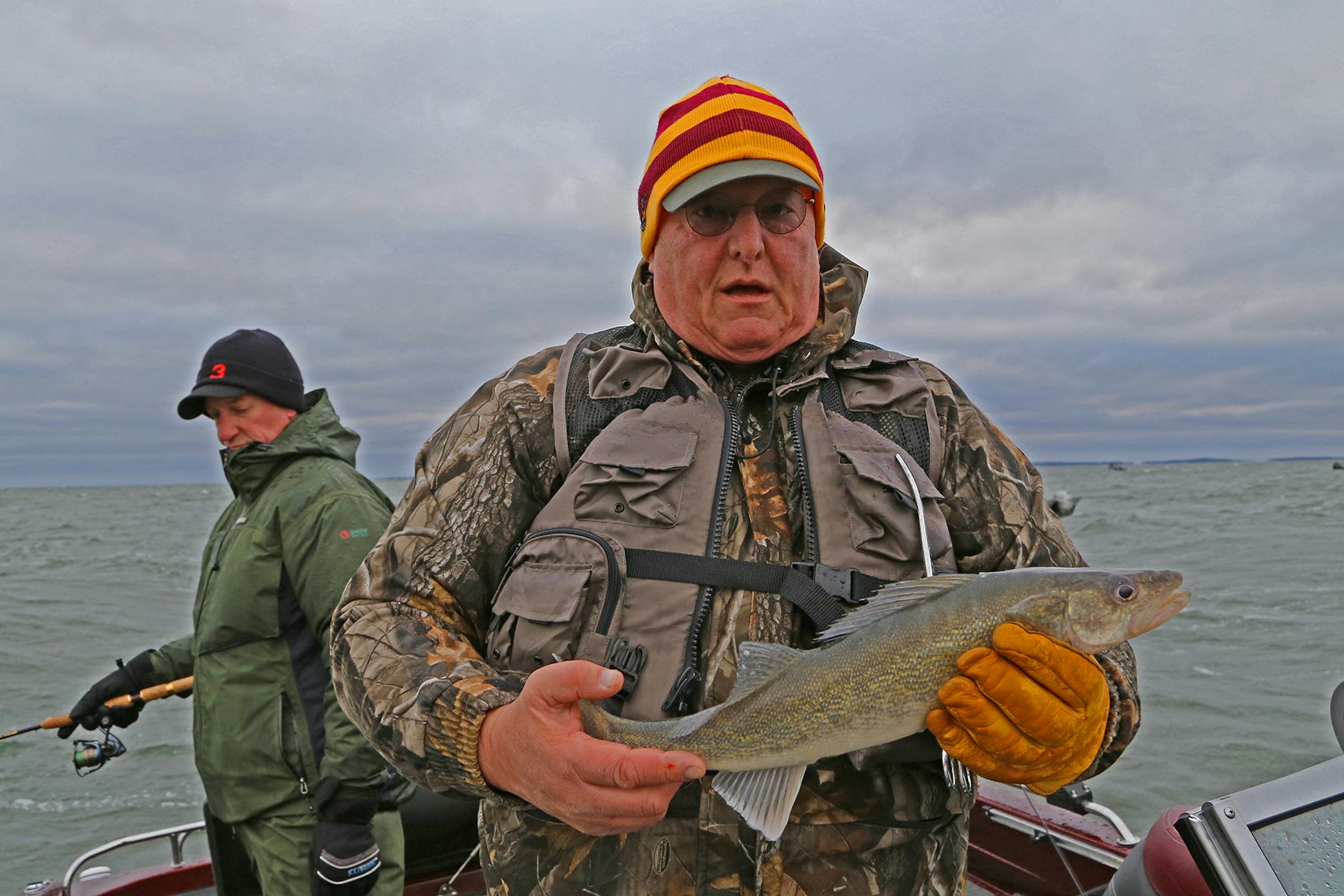 Cold, wet � but happy. John Weyrauch of Stillwater kept this 19-inch walleye, a legal fish on Leech Lake when the inland fishing season began on Saturday.