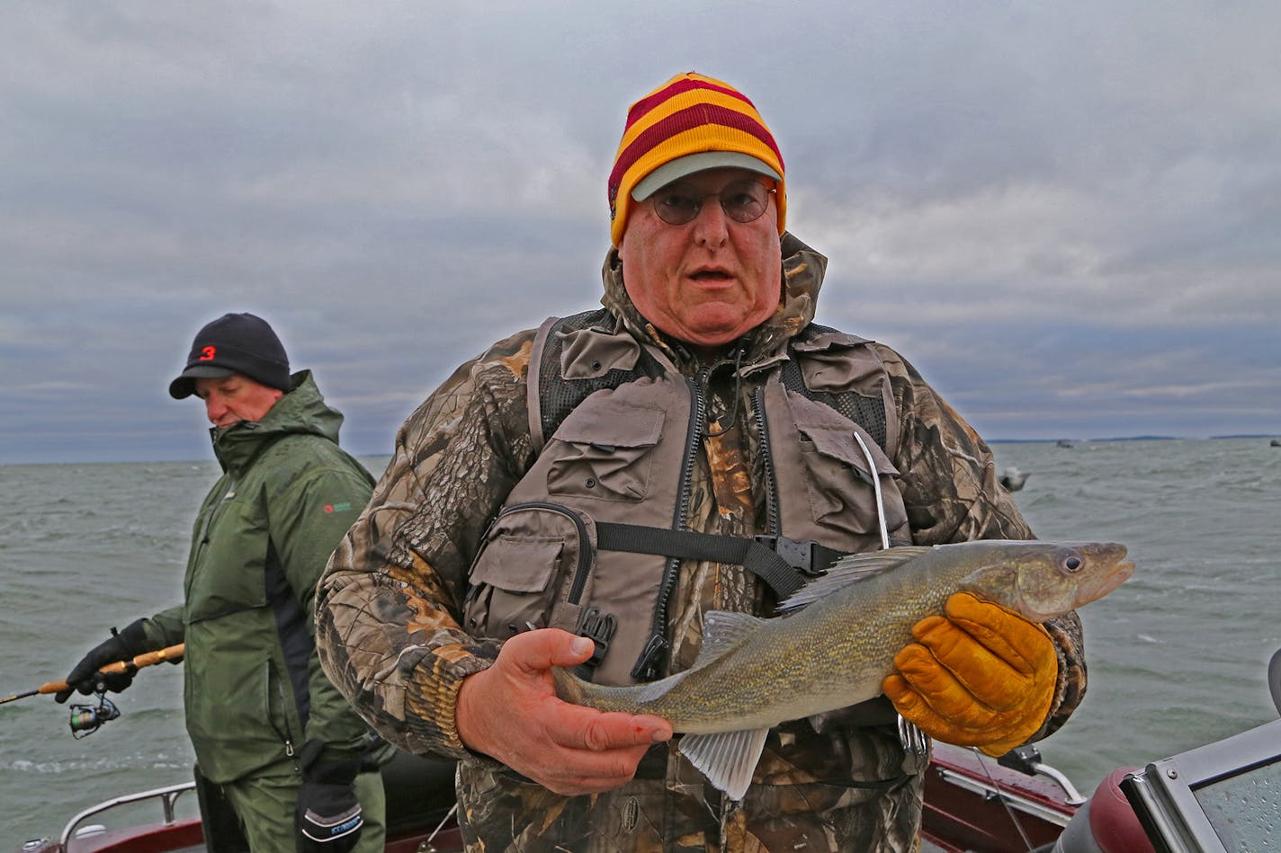 Cold, wet � but happy. John Weyrauch of Stillwater kept this 19-inch walleye, a legal fish on Leech Lake when the inland fishing season began on Saturday.