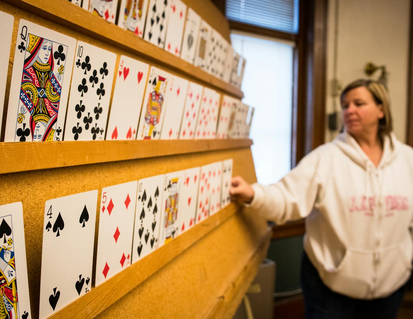 Debra Silvernale, of Madison Lake, placed oversized playing cards on a board after they were called during a game of afternoon Mingo at Thompson Hall. ] (AARON LAVINSKY/STAR TRIBUNE) aaron.lavinsky@startribune.com For 100 years, Thompson Hall in St. Paul has been thee social epicenter for Minnesota's deaf community. We step into these hallowed halls of Minnesota's deaf club on a Saturday night to find out if it's still the hot hangout for playing Mingo (Bingo), drinking a beer, and signing with