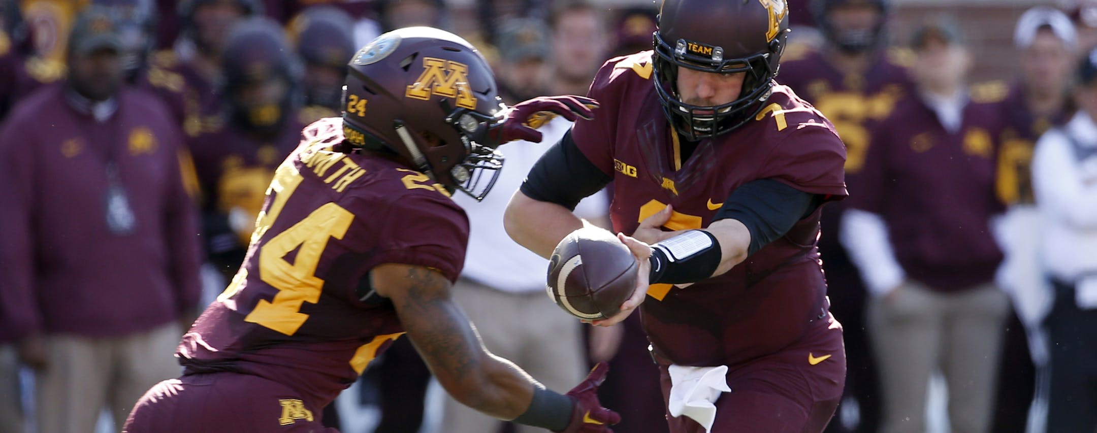 Minnesota quarterback Mitch Leidner (7) hands the ball off to running back Rodney Smith (24) during the first half an NCAA college football game against Nebraska, Saturday, Oct. 17, 2015, in Minneapolis. (AP Photo/Ann Heisenfelt) ORG XMIT: MNAB10