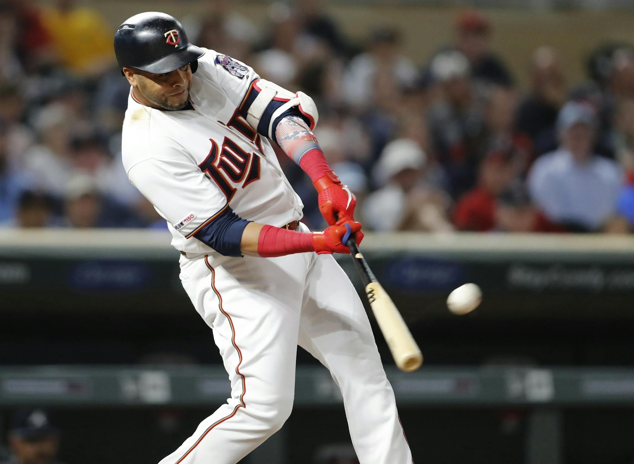 Minnesota Twins designated hitter Nelson Cruz (23) hits a home run in the seventh inning.