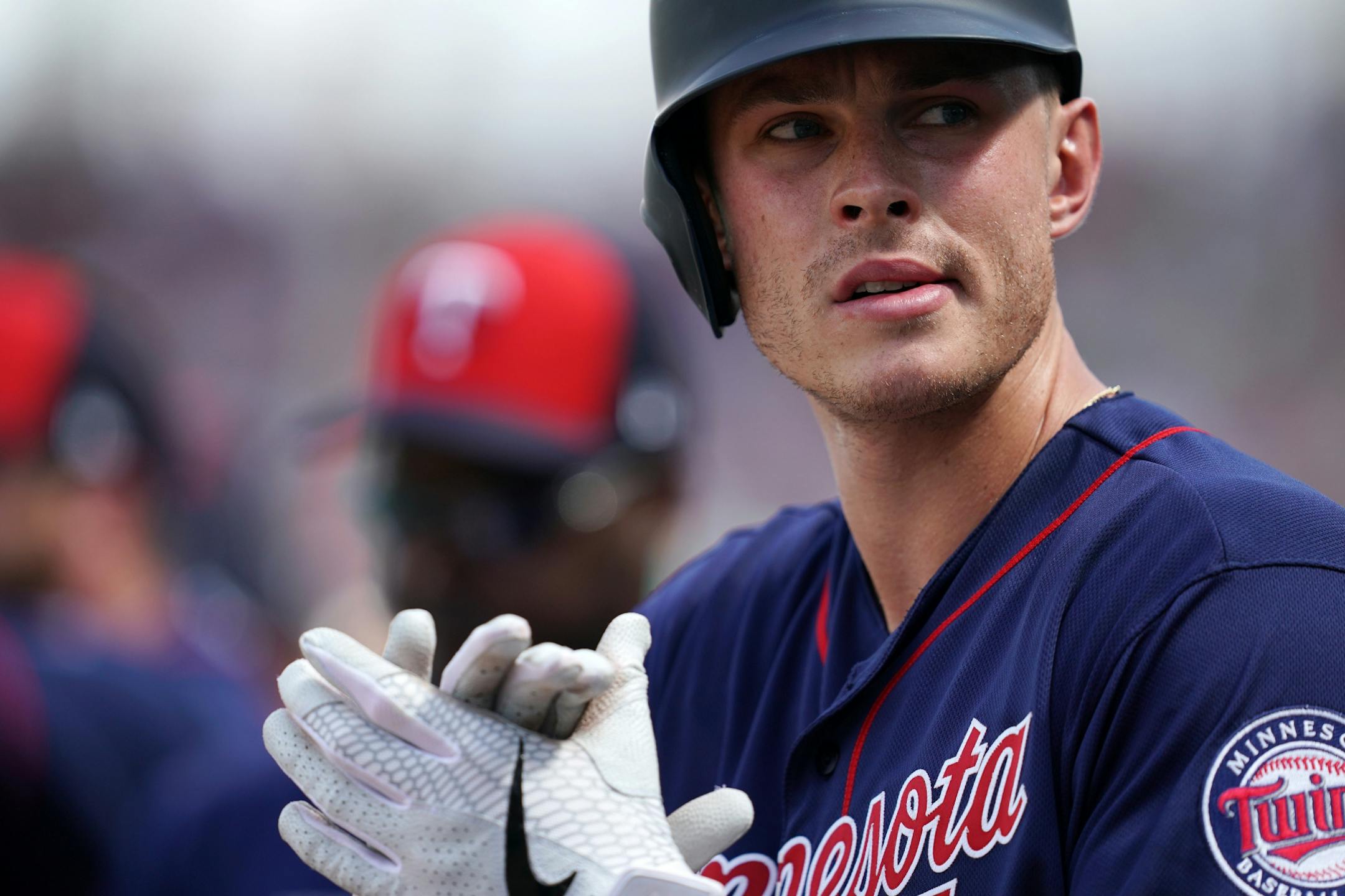 Minnesota Twins right fielder Max Kepler (26) looked to the stands as he waited in the dugout before Sunday's game.