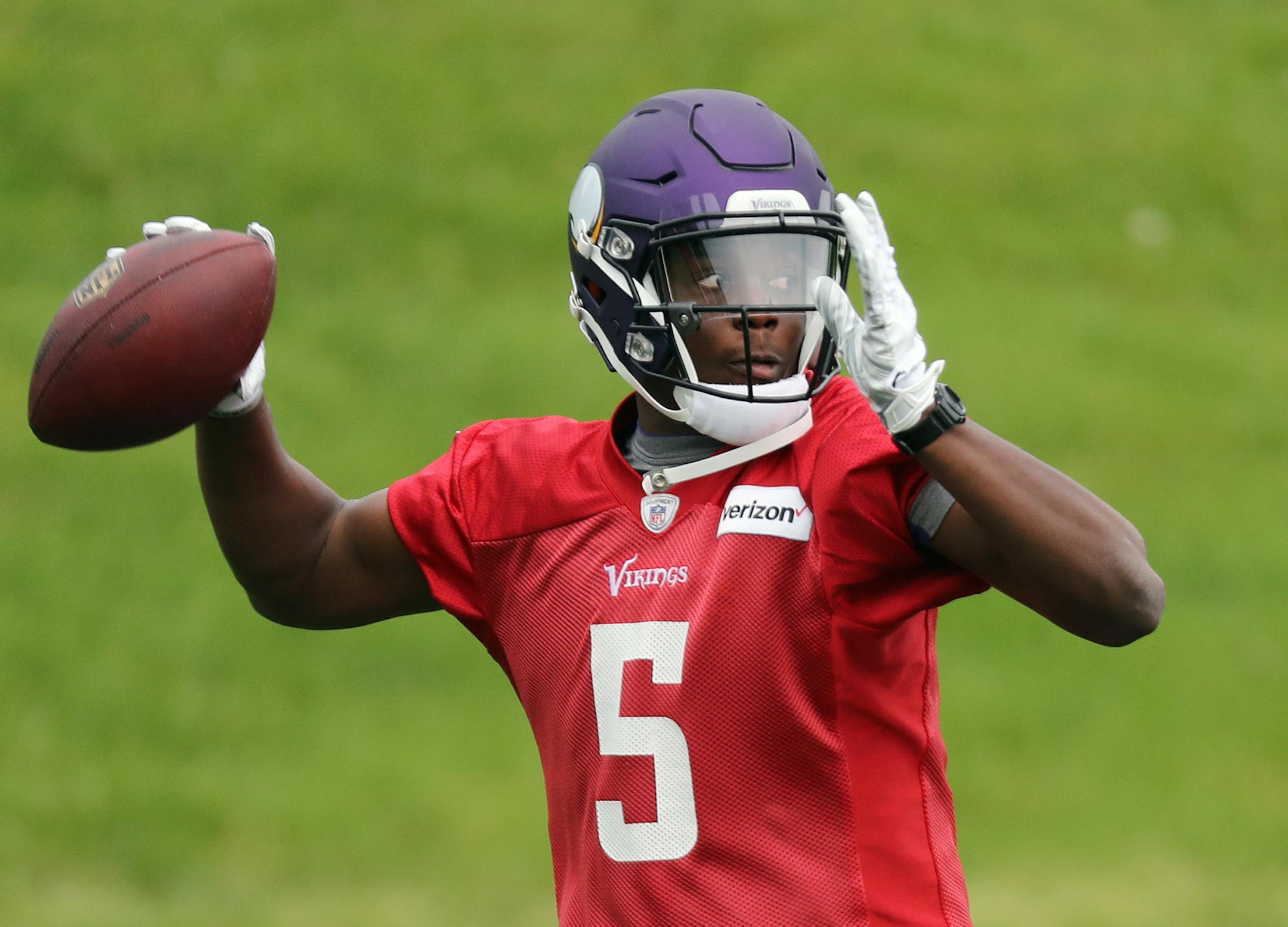 Quarterback Teddy Bridgewater throws the ball during minicamp in Eden Prairie.