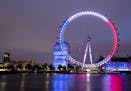 The London Eye is illuminated in the colors of the French flag in tribute to the attacks in Nice, in London, Friday, July 15, 2016.