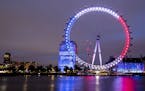 The London Eye is illuminated in the colors of the French flag in tribute to the attacks in Nice, in London, Friday, July 15, 2016.