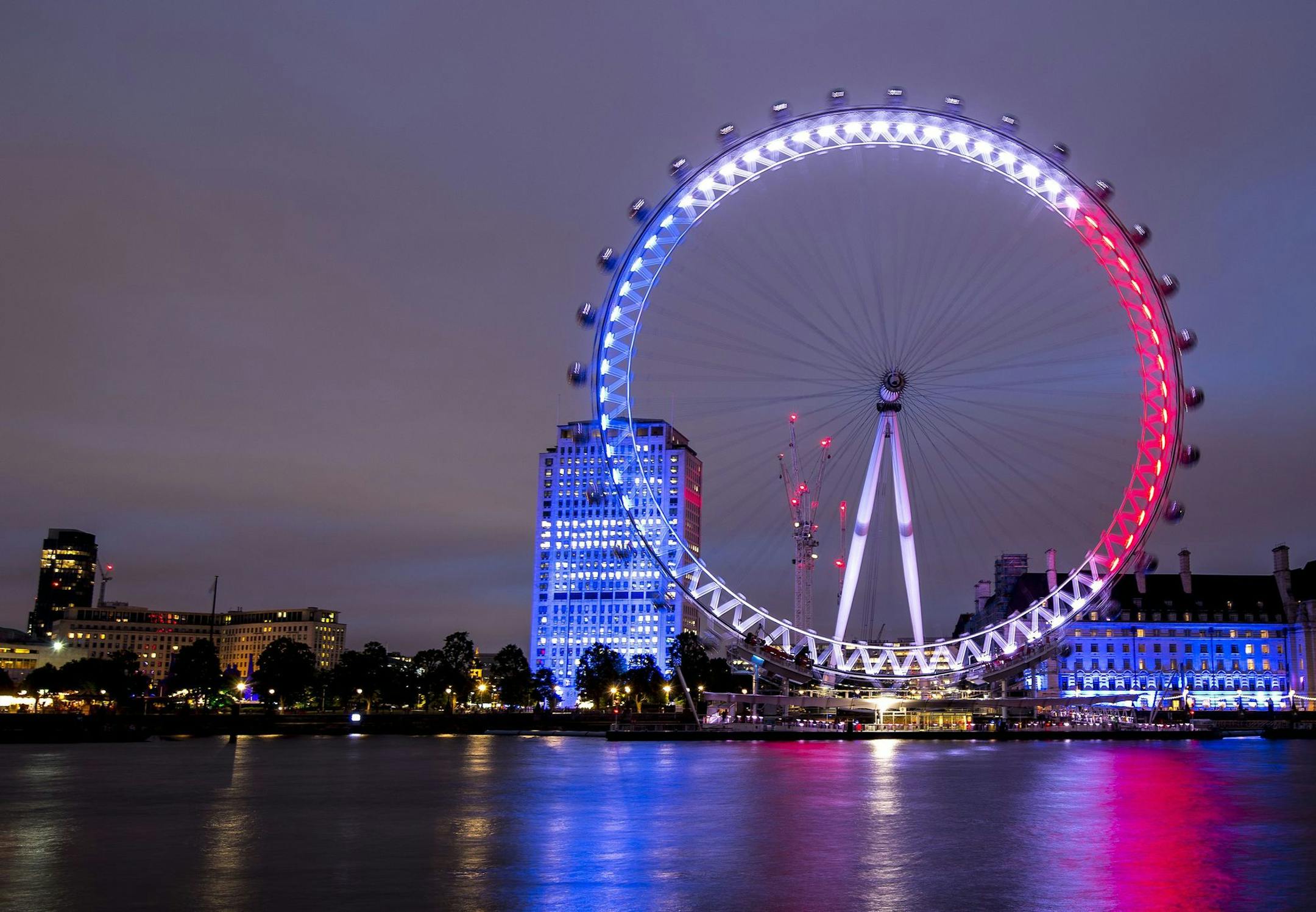 The London Eye is illuminated in the colors of the French flag in tribute to the attacks in Nice, in London, Friday, July 15, 2016.