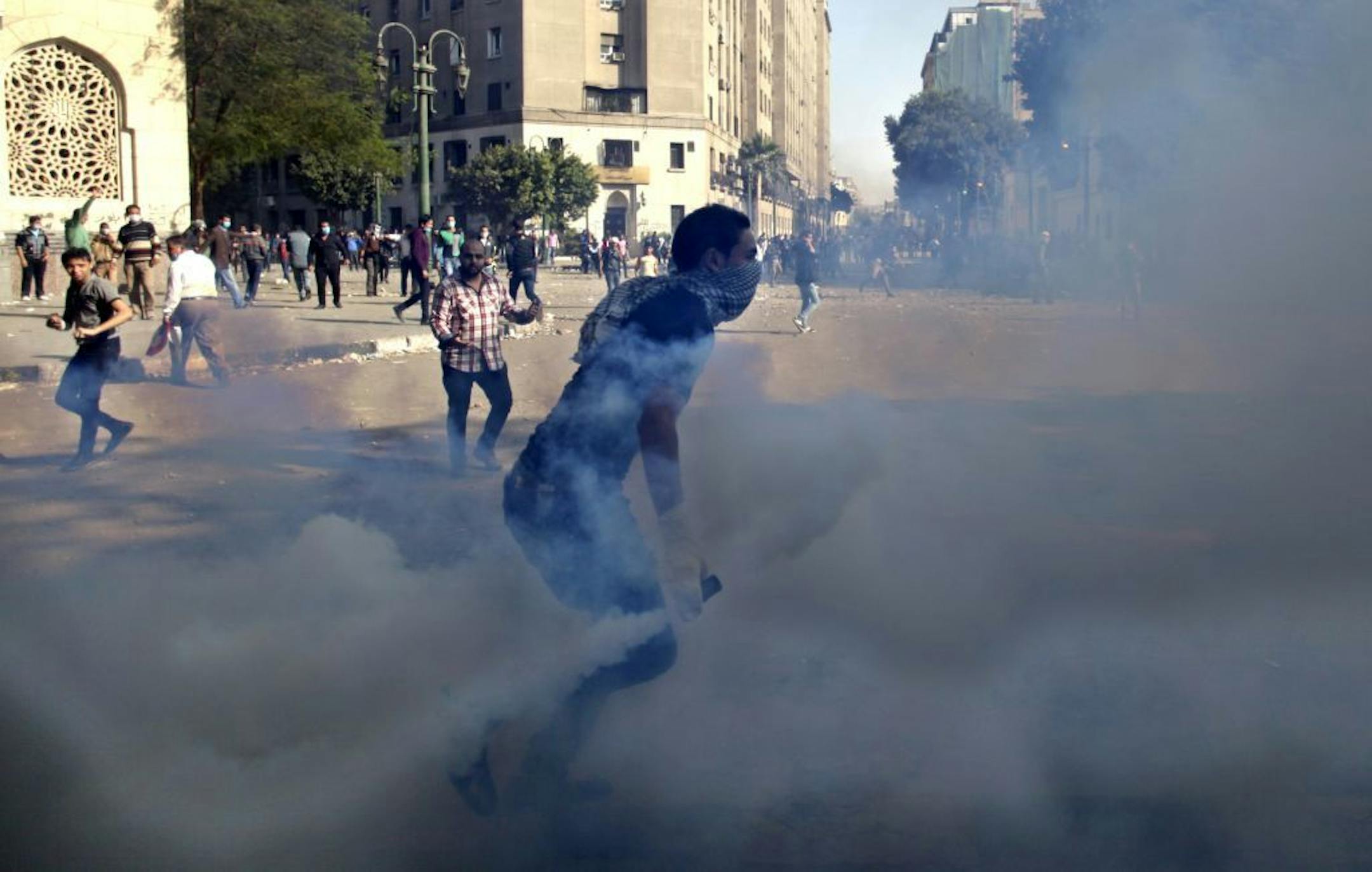 Egyptian protesters clash with security forces near Tahrir square, in Cairo, Egypt, Wednesday, Nov. 28, 2012. Egyptian state television says the country's highest appeal court has decided to suspend its work nationwide to protest the president's decrees giving himself nearly absolute powers.