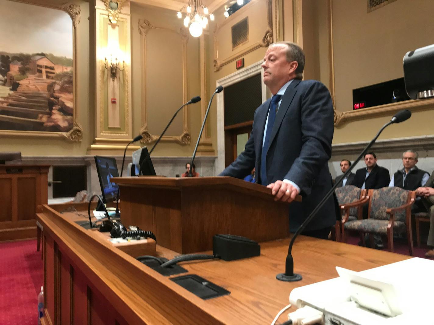 Minneapolis landlord Steve Frenz stands before a council committee last month to request that his rental license revocation be stayed. The request was denied, and the full council did so Friday.