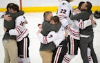 Lakeville North players and coaches celebrate their victory over Duluth East in the 2015 Class 2A title game.