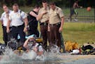 Fire officials searched for a body in Webber Pool in Minneapolis Minn., on Saturday July 25, 2015. No body was found and the pool will resume normal h