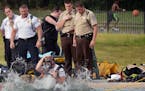 Fire officials searched for a body in Webber Pool in Minneapolis Minn., on Saturday July 25, 2015. No body was found and the pool will resume normal h