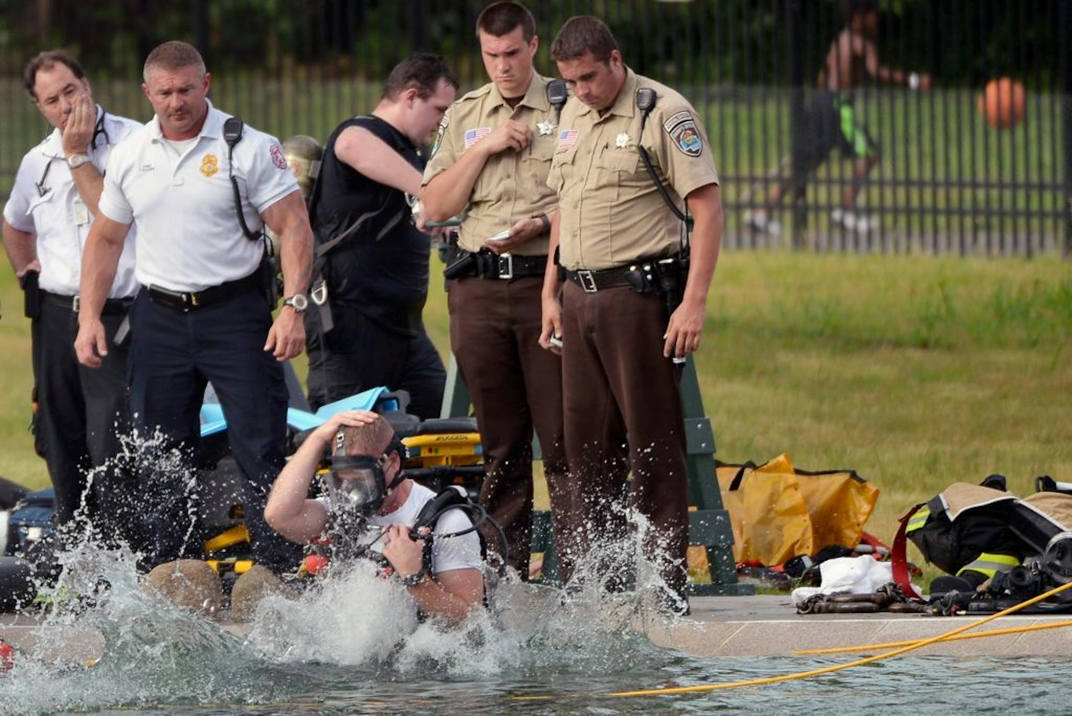Fire officials searched for a body in Webber Pool in Minneapolis Minn., on Saturday July 25, 2015. No body was found and the pool will resume normal hours on Sunday July 26, 2015.