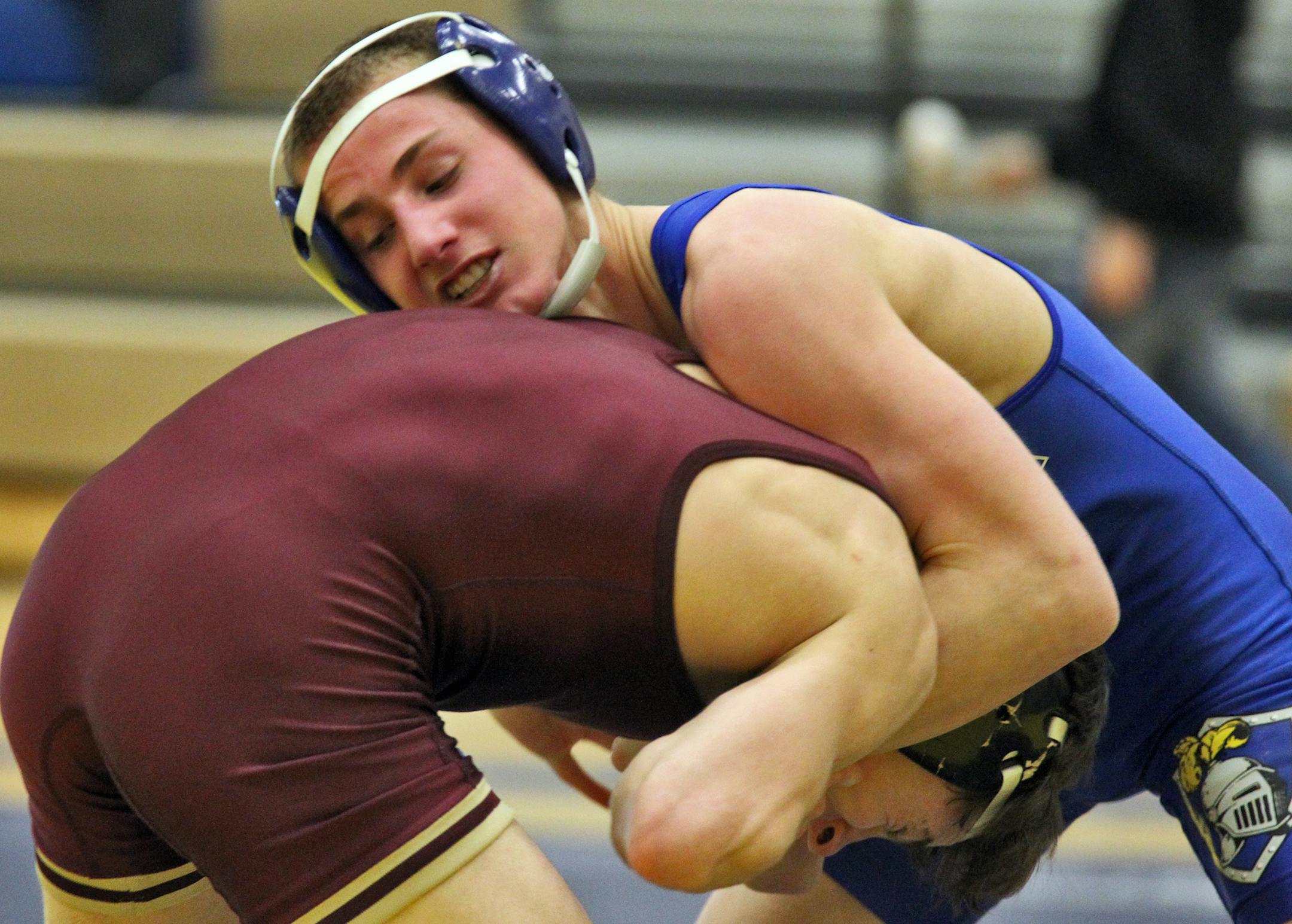 Tommy Thorn (in blue), at 120 pounds, is one of four St. Michael-Albertville wrestlers ranked No. 1 in his weight class. He has already won two individual state titles.