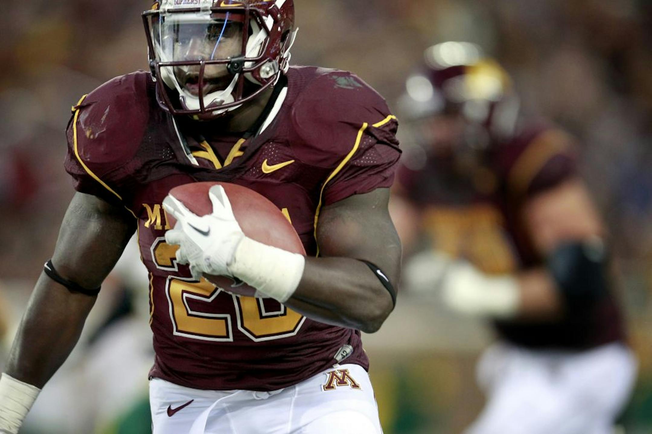 Minnesota running back Donnell Kirkwood (20) ran for a touchdown in the second quarter.