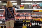 A customer shops for meat at a supermarket on June 10 in Chicago. The consumer price index was up 6.2% from a year ago in October.