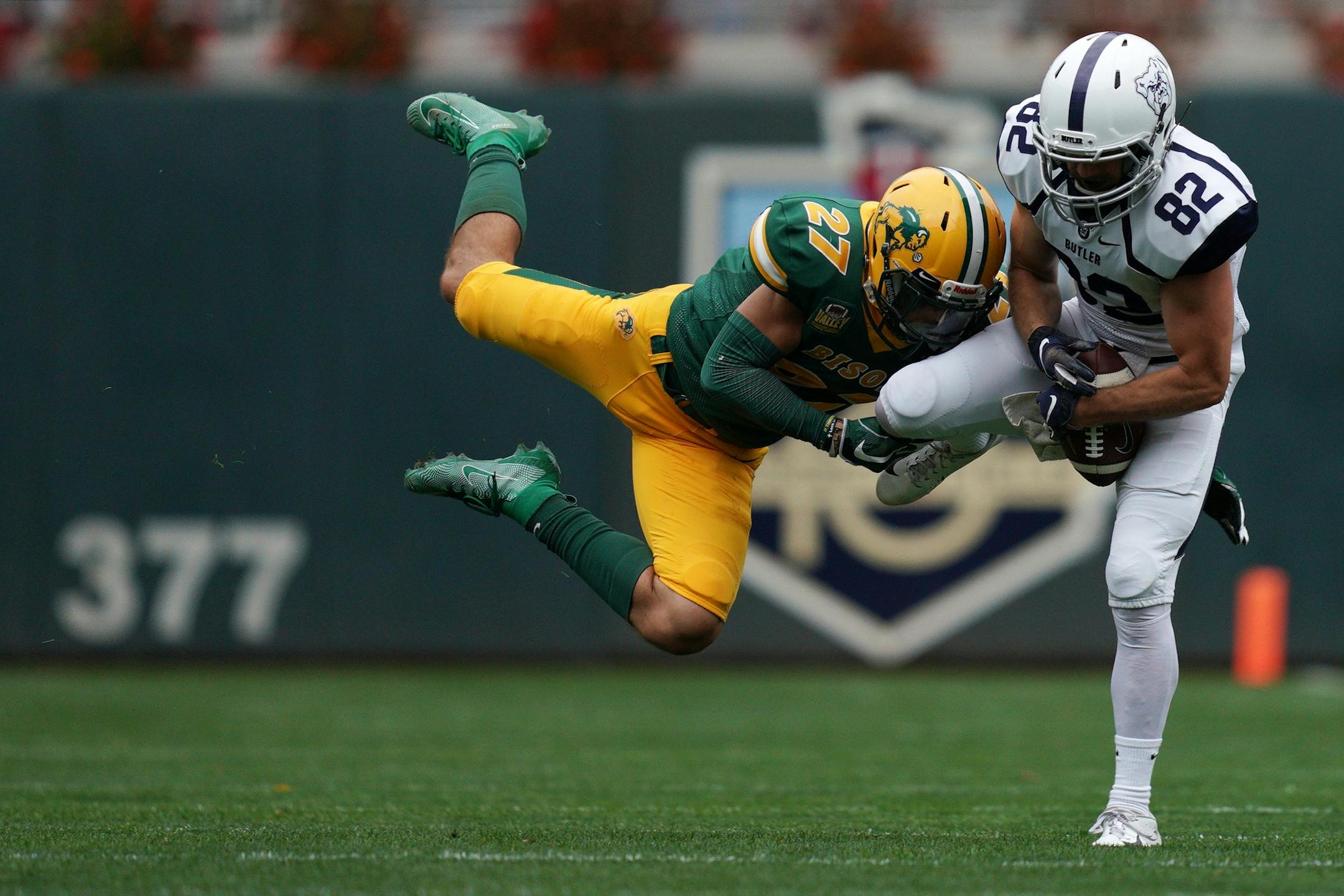 North Dakota State Bison safety Dawson Weber (27) tried to break up a pass meant for Butler Bulldogs wide receiver John Turley (82) in the second half.