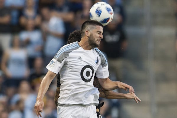 Minnesota United FC Defender Eric Miller (30) heads the ball away during the match between Sporting Kansas City and Minnesota United FC on Sunday June